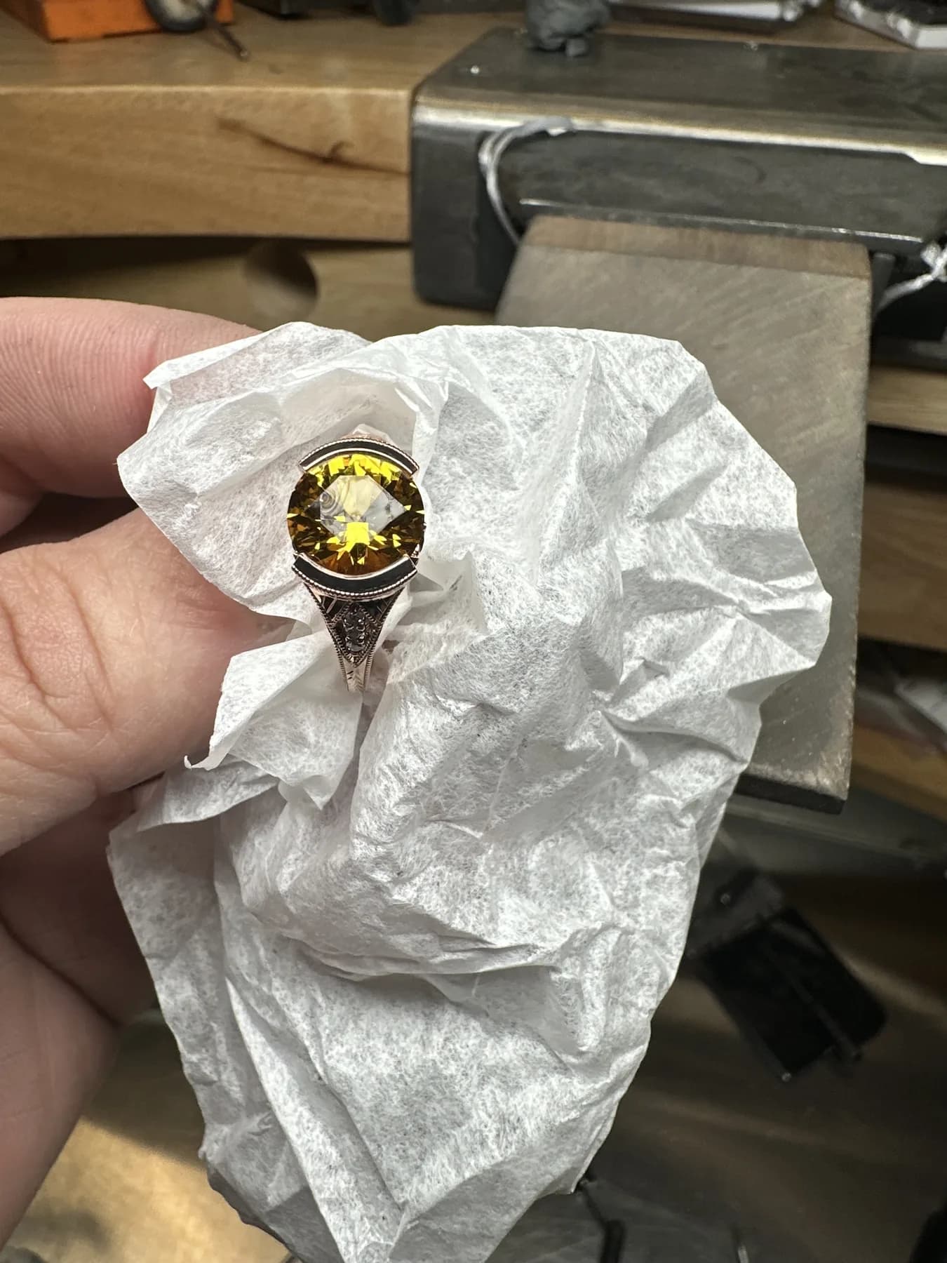 Custom engraved ring with a round yellow gemstone